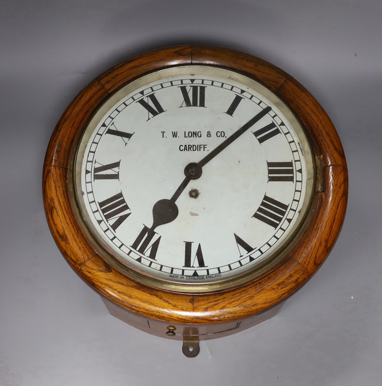 An early 20th century oak fusee wall dial retailed by TW Long &Co, Cardiff, 40cms diameter